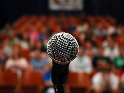 A mic is the only thing that stands between the audience and its prey.